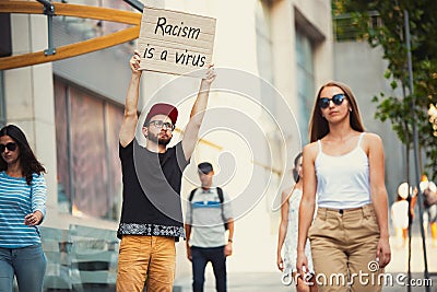 Dude with sign - man stands protesting things that annoy him Stock Photo