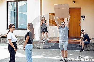 Dude with sign - man stands protesting things that annoy him Stock Photo