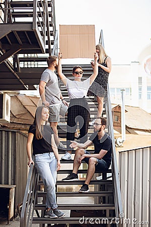 Dude with sign - woman stands protesting things that annoy her Stock Photo