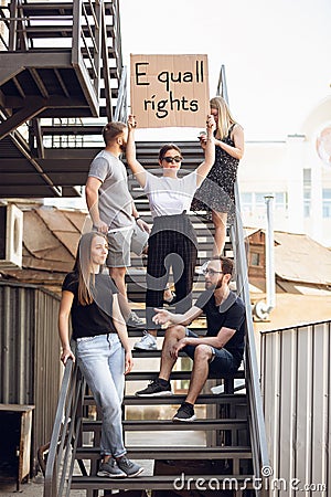 Dude with sign - woman stands protesting things that annoy him Stock Photo