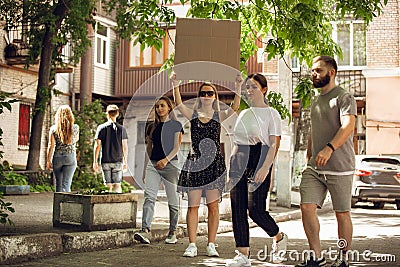 Dude with sign - woman stands protesting things that annoy her Stock Photo