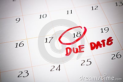 Due Date day, the 18th, Red circled mark on a white calendar, as Stock Photo