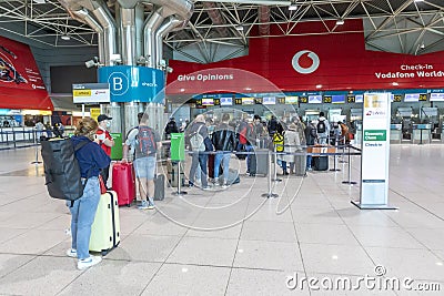 Due to Corona most flights from Lisbon are cancelled. Strict distance and mask rules are controlled at Lisbon airport for the Editorial Stock Photo