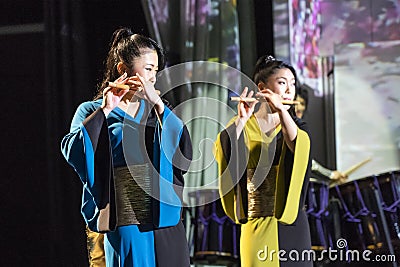 Duet of Pretty Girls are Playing Flutes Editorial Stock Photo