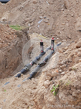Dug pipes. Dug pipes. For repair at a construction site. communication wiring to the house Stock Photo