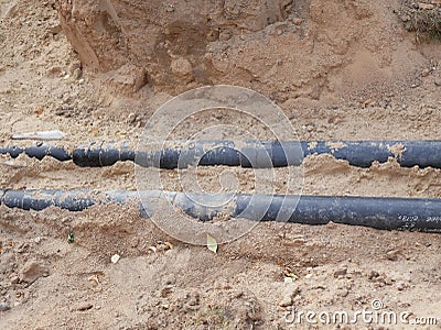 Dug pipes. Dug pipes. For repair at a construction site. communication wiring to the house Stock Photo