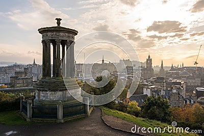 Dugald Stewart monument on Calton Hill with a view on Edinburgh Editorial Stock Photo