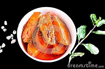 Top view of Dum Aloo or Fried potato curry, Indian Kashmiri gravy with kosher salt,mint.Isolated on black background. Stock Photo