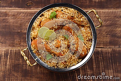 Dum chicken biriyani on a rustic background Stock Photo