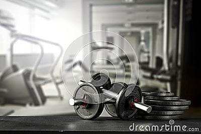 Dumbbell, barbell and workout in the gym. Copy space for text or decoration. Stock Photo