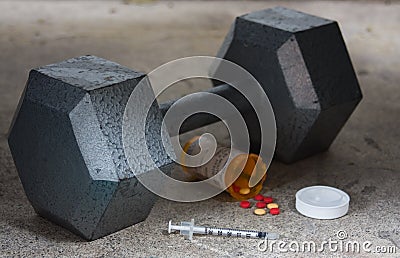 Dumbbell with Steroids and Needle Stock Photo