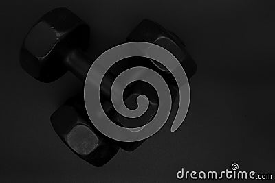 Dumbbells or weights for exercise on a black background Stock Photo