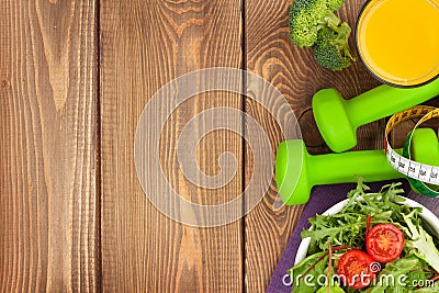 Dumbells, tape measure and healthy food. Fitness and health Stock Photo