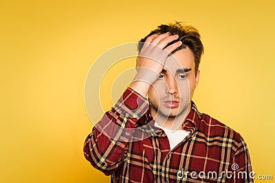 Regret remorse dismay man emotion clutch head Stock Photo