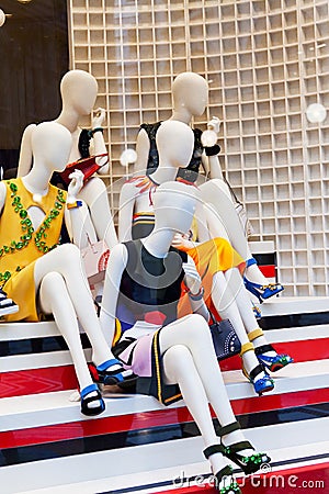Dummies in a show-window of shop of fashionable clothes Editorial Stock Photo