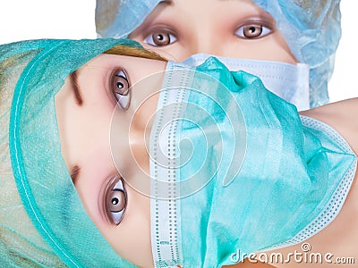 Dummy doctor heads wearing textile surgical cap and mask Stock Photo