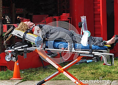 Dummy injured person on stretcher Stock Photo