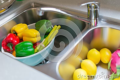 Dummy ripe fruits and vegetable in sink Stock Photo