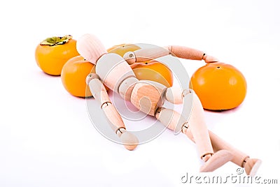 Dummy and ripe persimmon Stock Photo