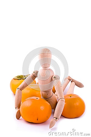 Dummy and ripe persimmon Stock Photo