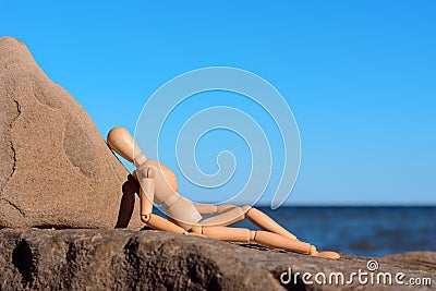 Dummy on stony coast Stock Photo