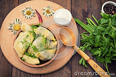 Dumplings with the liver. Wooden background. Top view Stock Photo