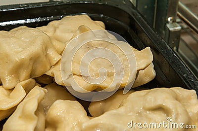 Dumplings stuffed with cheese and potatoes Stock Photo
