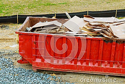 Dumpster with industrial waste isolated on white background. Stock Photo