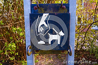 Dumpster for pet excrement in a public park. Cleaning dogs excrement on street Stock Photo