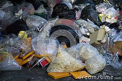 Dumpsters being full with garbage in the evening Stock Photo