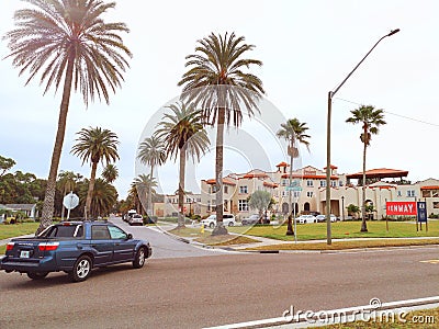 Dunedin, Florida, USA - December 27, 2018: Fenway luxury hotel in town of Dunedin in Florida surrounded by large tall palm trees. Editorial Stock Photo