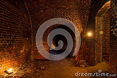 Dungeon under the old Prussian fortress illuminated by candles, Kaliningrad Stock Photo