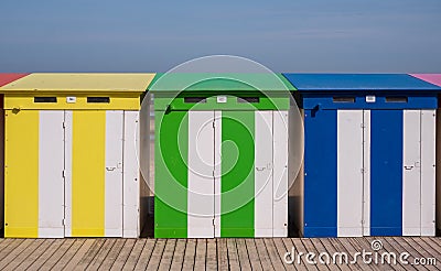 Dunkerque, France: Candy colored striped beach huts on the sea front at Malo-Les-Bains beach in Dunkirk Editorial Stock Photo
