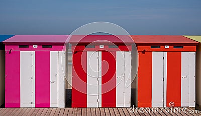 Dunkerque, France: Candy colored striped beach huts on the sea front at Malo-Les-Bains beach in Dunkirk Editorial Stock Photo