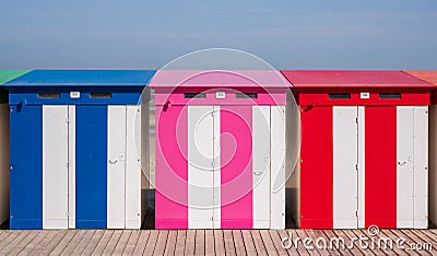 Dunkerque, France: Candy colored striped beach huts on the sea front at Malo-Les-Bains beach in Dunkirk Editorial Stock Photo