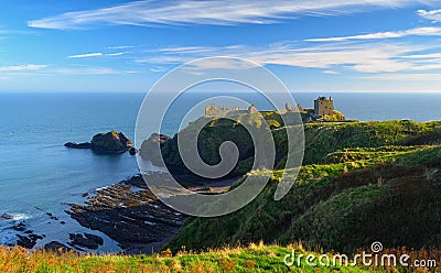 Dunnottar Castle with blue sky background in Aberdeen, Scotland. Stock Photo