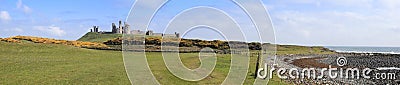 Dunstanburgh castle panorama northumberland coast Uk Stock Photo