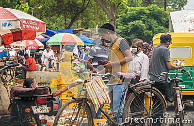 People wearing Mask in a Market place . Editorial Stock Photo