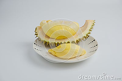 Durian in a plate on a white background and clipping path. Durian is a Thai fruit that is delicious and has a pleasant aroma Stock Photo