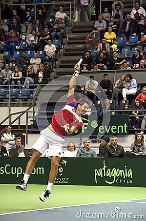 Dusan Lajovic serving a ball-1 Editorial Stock Photo