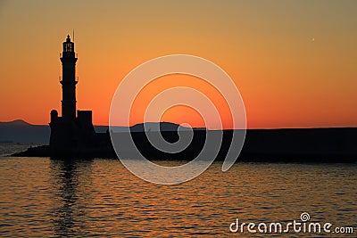 Dusk at harbor with lighthouse Chania Crete Stock Photo