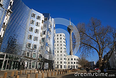 View on Gehry houses with silver shiny futuristic metallic aluminium facade with tv tower Editorial Stock Photo