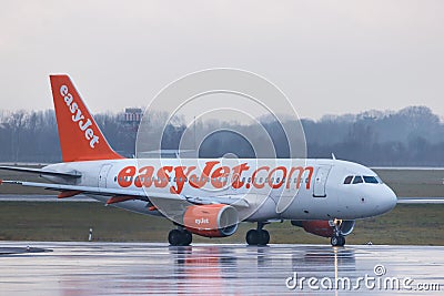 Dusseldorf, nrw/germany - 11 01 18: easy jet airplane at dusseldorf airport germany in the rain Editorial Stock Photo
