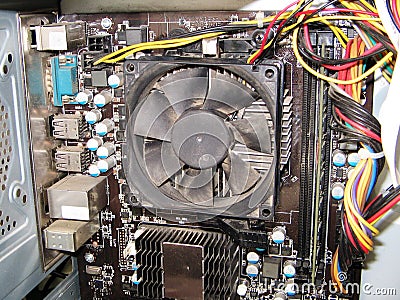 Dust on the computer pc processor cooler with mainboard and computer case fragment Stock Photo