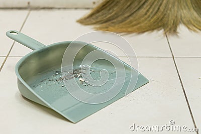 Dust in the gray plastic dustpan Stock Photo