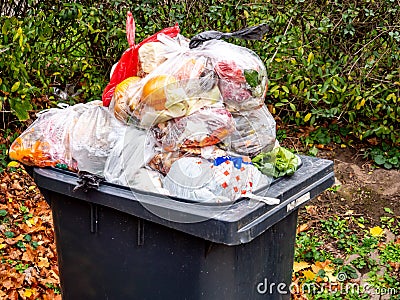 Dustbin with many garbage bags Stock Photo