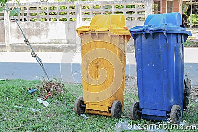 Dustbins in the colors blue, yellow. recycling of large bins Stock Photo