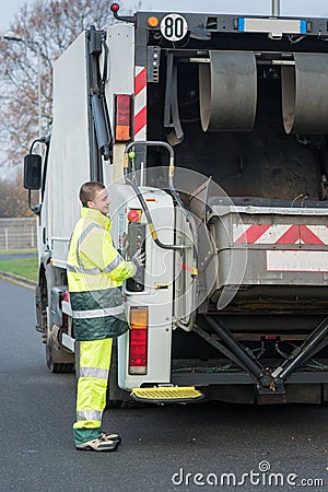 dustman next to lorry bin Stock Photo