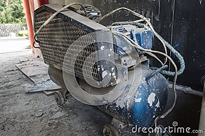 Dusty air compressor Stock Photo