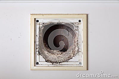 Dusty air vent in the wall Stock Photo